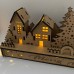 Wooden Christmas light up decoration featuring a village scene with tree and houses. Laser cut wood is hand assembled with LED lights.
