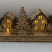 Wooden Christmas light up decoration featuring a village scene with tree and houses. Laser cut wood is hand assembled with LED lights.