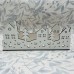 White wood Christmas scene featuring houses and trees â ideal for windowsill or mantlepiece White wood Christmas scene featuring houses and trees â ideal for windowsill or mantlepiece